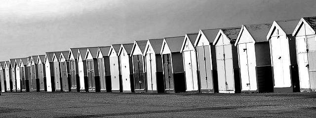 a row of beach huts in Brighton and hove
